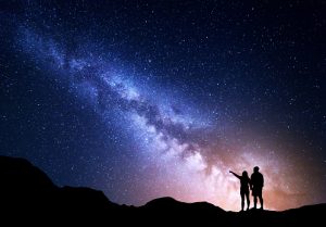 The mystery of love, two people looking at the stars